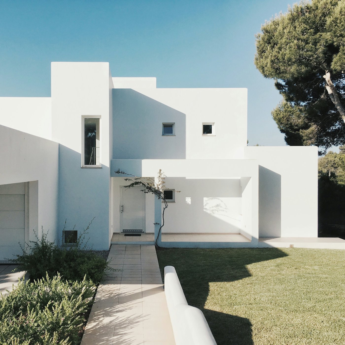White minimalist home in bright sun